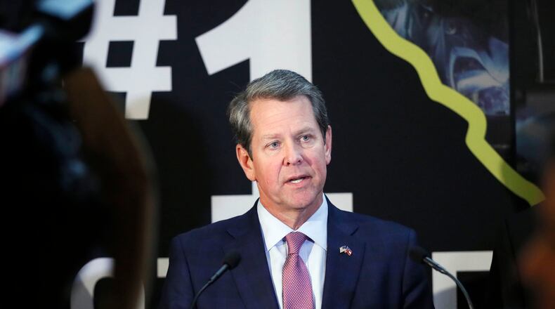Gov. Brian Kemp at the state Capitol this March with leaders of the Legislature following the passage of Senate Bill 106, laying the groundwork for his health care “waivers.” Dec. 3 is the final day for members of the public to comment on the plans. PHOTO by Bob Andres / bandres@ajc.com