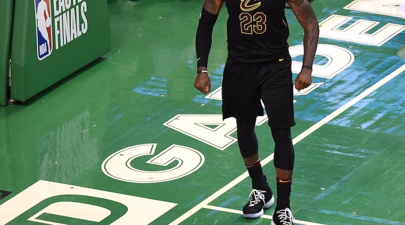 Cleveland Cavaliers forward LeBron James (23) reacts after making a basket during the second half in game seven of the Eastern conference finals of the 2018 NBA Playoffs against the Boston Celtics at TD Garden.