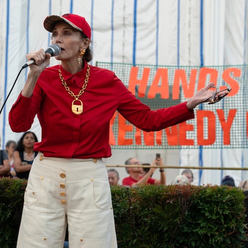 Actress Lynda Carter speaks to the crowd as they rally against the closing of the John F. Kennedy Center for the Performing Arts on Friday, Sept. 18, 2026, in Washington. ( (AP Photo/Jose Luis Magana)