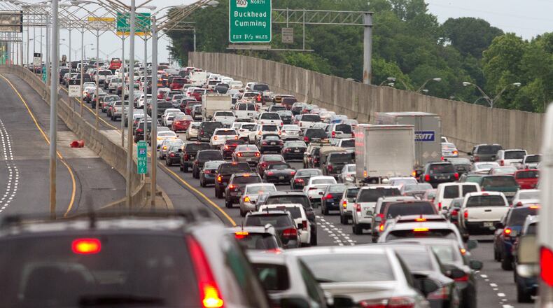 Cars backed up as the Georgia Department of Transportation reopened the northbound lanes of the rebuilt portion of I-85 in Atlanta on Friday evening, May 12, 2017. STEVE SCHAEFER / SPECIAL TO THE AJC