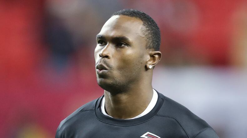 Injured Falcons wide receiver Julio Jones watches his teammates warmup for an NFL football game against the 49ers on Sunday, Dec. 18, 2016, in Atlanta. Curtis Compton/ccompton@ajc.com