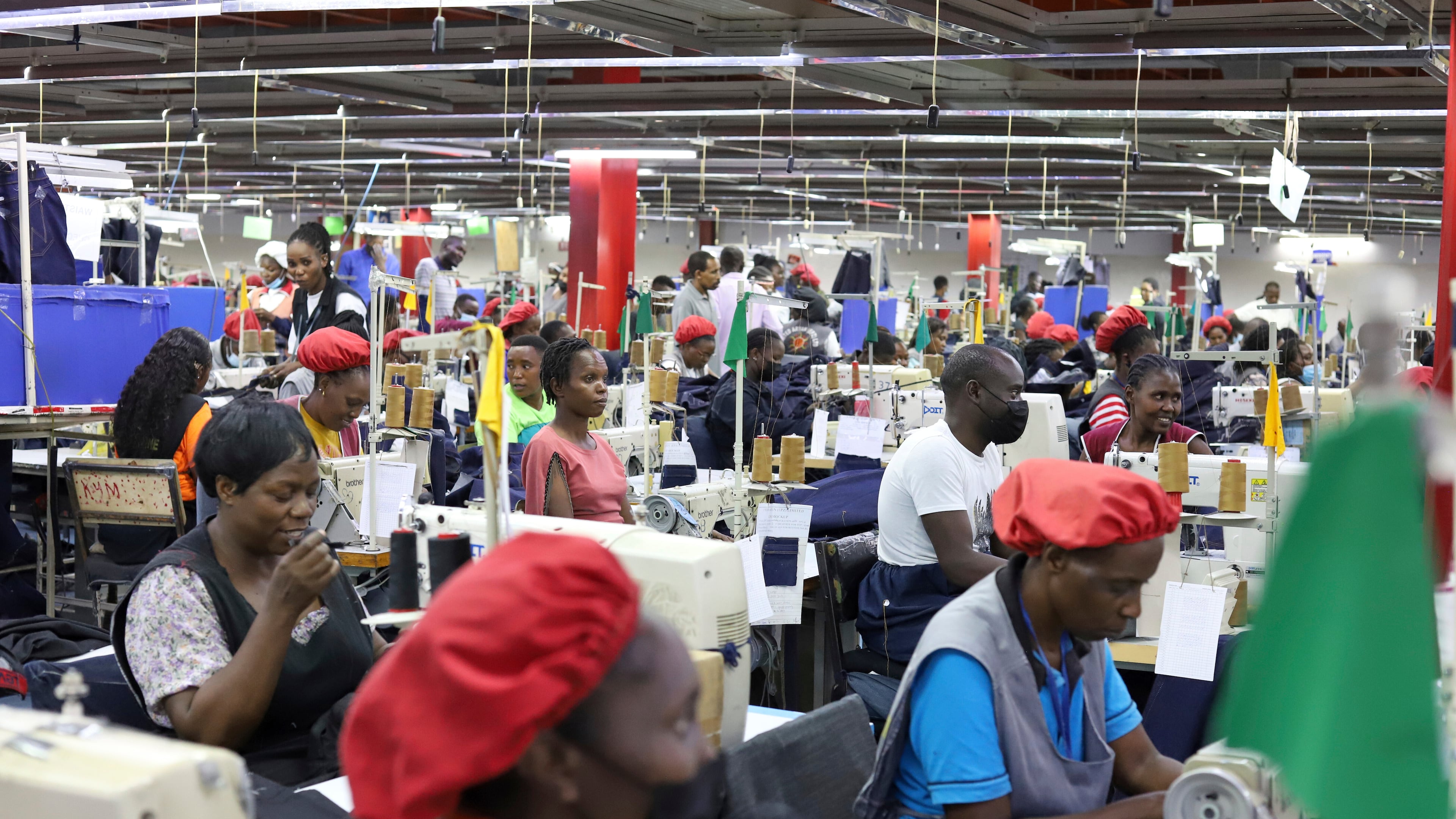 FILE - Factory workers operate machines to make garments at United Aryan EPZ Limited in Ruaraka on the outskirts of Nairobi, Kenya, March 21, 2025. (AP Photo/Andrew Kasuku, File)