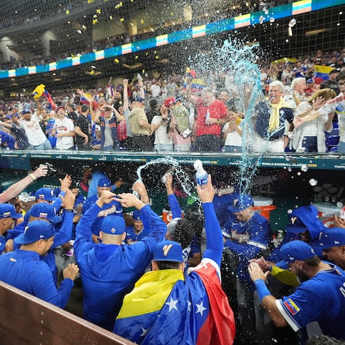 The Venezuela team celebrates after defeating Italy at a World Baseball Classic semifinal game, Monday, March 16, 2026, in Miami. (AP Photo/Rebecca Blackwell)