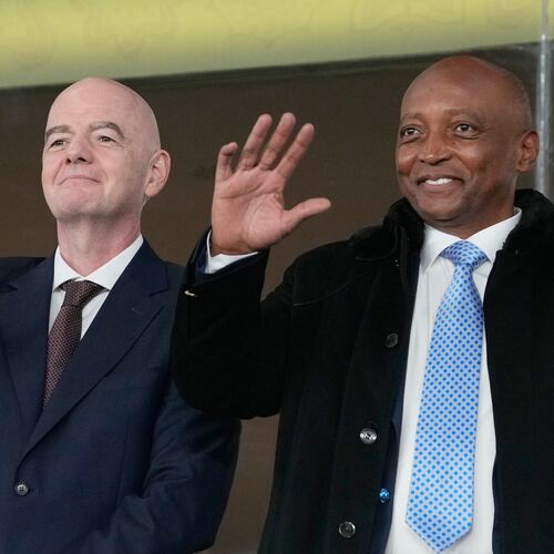 FILE - CAF President Patrice Motsepe and FIFA President Gianni Infantino wave from the tribune during the Africa Cup of Nations round of 16 soccer match between South Africa and Cameroon in Rabat, Morocco, Sunday, Jan. 4, 2026. (AP Photo/Themba Hadebe, File)