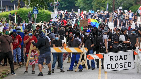 8/15/20 - Stone Mountain, GA - Several far-right groups, including militias and white supremacists, were planning to rally Saturday at Stone Mountain, and a broad coalition of leftist anti-racist groups are organizing a counter-demonstration. Local authorities, who have been closely monitoring online chatter about the rally, are bracing for possible conflict.   Steve Schaefer for the Atlanta Journal Constitution