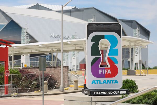 The FIFA World Cup 2026 countdown clock is shown near the Georgia International Plaza and Mercedes-Benz Stadium (Jason Getz / AJC)