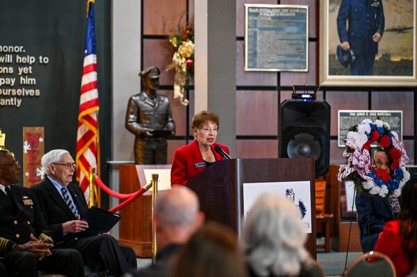 Savannah Navy League member Judy Roddy reads “The Voice from the Arizona” during the Pearl Harbor Remembrance Day event at coastal Georgia's National Museum of the Mighty Eighth Air Force on Sunday, Dec. 7, 2025. (Sarah Peacock for the AJC)