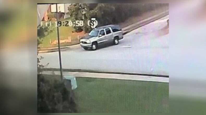 Police are searching for at least two suspects who opened fire on a group of people in a Newton County neighborhood before speeding away in an SUV.