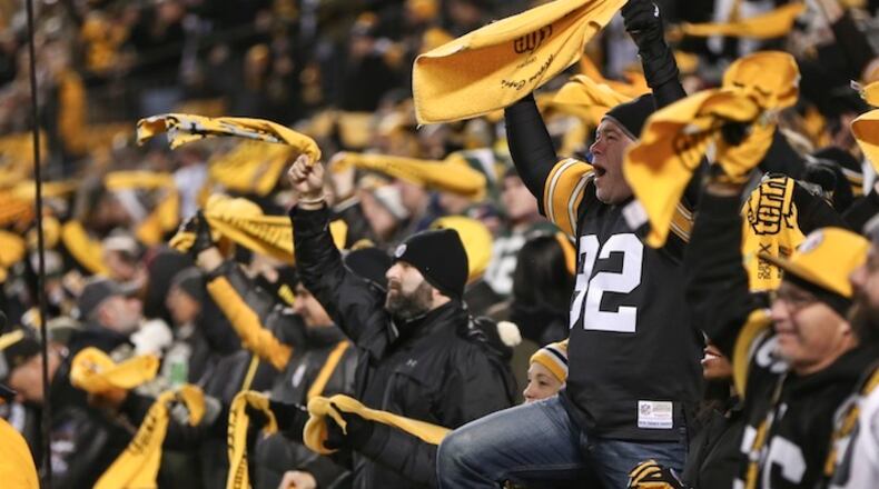 Pittsburgh Steelers fans wave their Terrible Towels during an NFL football game against the Green Bay Packers, Sunday, Nov. 26, 2017, in Pittsburgh. (AP Photo/Keith Srakocic)