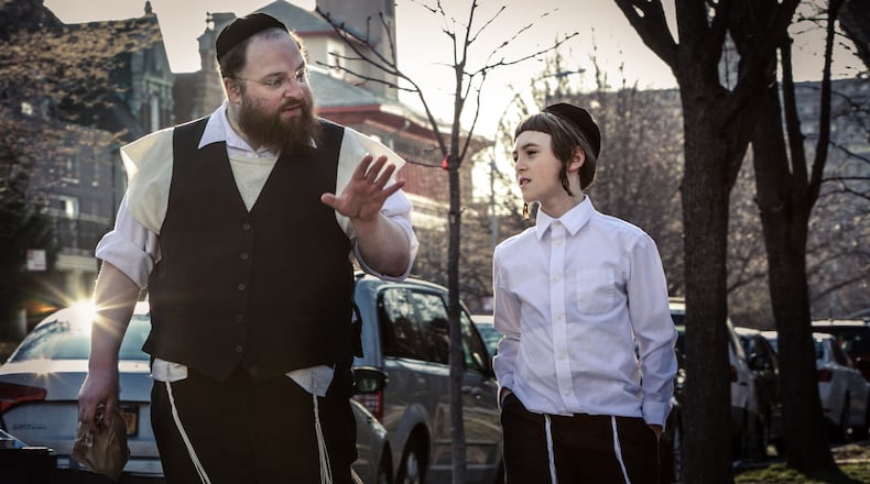Actor Menashe Lustig (left) and Ruben Niborski star in director Joshua Z. Weinstein’s film “Menashe,” the closing night film of the Atlanta Film Festival. (A24 Films/Federica Valabrega)