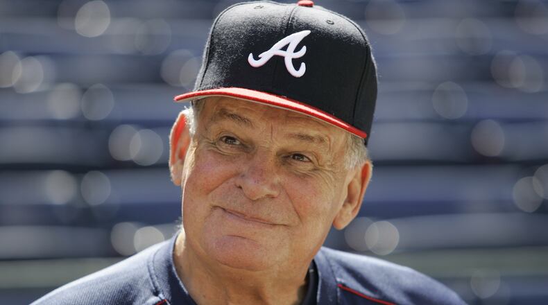 FILE - Atlanta Braves manager Bobby Cox smiles while talking to reporters during team practice at Turner Field in Atlanta, Oct. 4, 2005. (AP Photo/Ed Reinke, File)