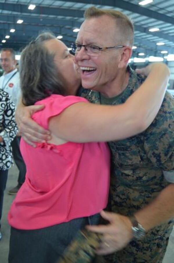 U.S. Marines Maj. Gen. Joseph Shrader receives a hug following a change of command ceremony. Shrader, who is retiring after near 40 years, was born in Albany and finished up his career at Marine Corps Logistics Base-Albany. (Courtesy of Alan Mauldin)
