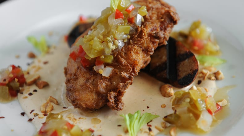 Grilled Louisiana andouille sausage with fried chicken, Cajun remoulade, chow-chow, peanuts and celery at Antebellum. (Contributed by Becky Stein)