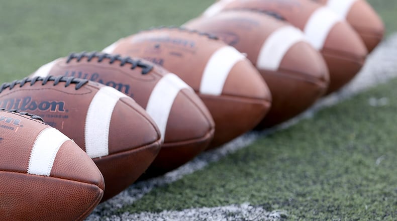 August 21, 2015 - Roswell, Ga: Footballs are placed at midfield before the game between Roswell and Lowndes Friday at Roswell High School in Roswell, Ga., AAugust 21, 2015. Tonight is the first game of the season for both Roswell and Lowndes. PHOTO / JASON GETZ