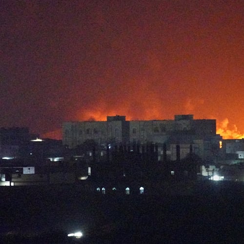 Flames and smoke rise from the port of Mokha during a strike in Yemen, Friday, Aug. 14, 2026. (AP Photo/Abdulnasser Alseddik)