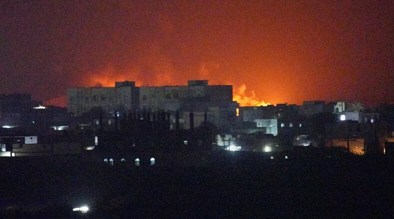 Flames and smoke rise from the port of Mokha during a strike in Yemen, Friday, Aug. 14, 2026. (AP Photo/Abdulnasser Alseddik)