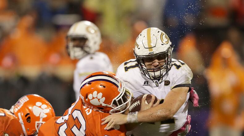 CLEMSON, SC - OCTOBER 28:  Matthew Jordan #11 of the Georgia Tech Yellow Jackets is hit by J.D. Davis #33 of the Clemson Tigers during their game at Memorial Stadium on October 28, 2017 in Clemson, South Carolina.  (Photo by Streeter Lecka/Getty Images)