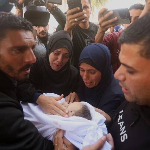 Palestinians mourn over an Al-Tanani family member, killed in an Israeli strike, during their funeral at Al-Shifa Hospital in Gaza City, Saturday, April 25, 2026. (AP Photo/Yousef Alzanoun)