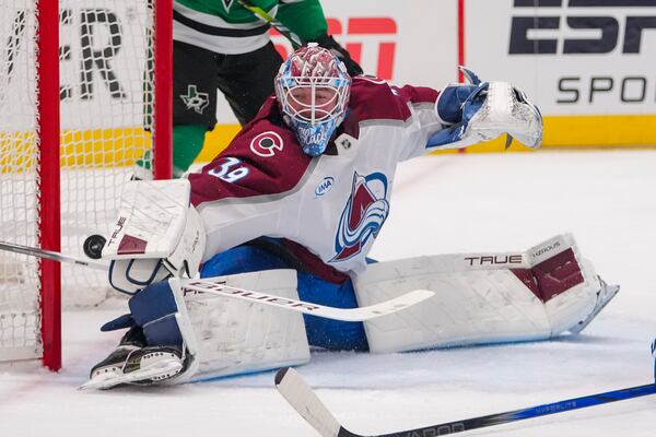 A shot by Dallas Stars center Tyler Seguin, not visible, gets by Colorado Avalanche goaltender Mackenzie Blackwood (39) for a power play goal during the first period in Game 2 of a first-round NHL hockey playoff series Monday, April 21, 2025, in Dallas. (AP Photo/Julio Cortez)