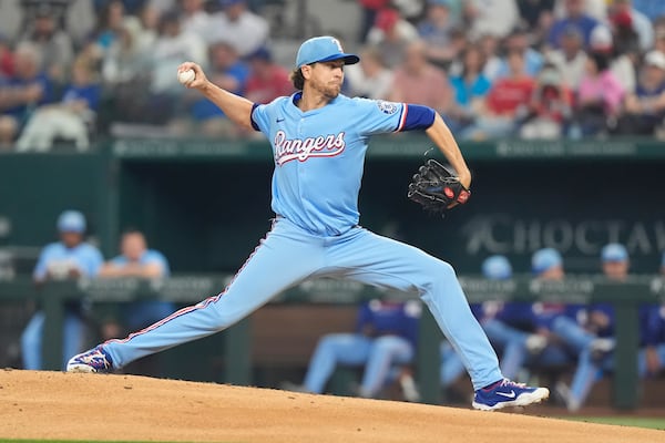 Texas Rangers starting pitcher Jacob deGrom throws during the fifth inning of a baseball game against the Boston Red Sox, Sunday, March 30, 2025, in Arlington, Texas. (AP Photo/LM Otero)