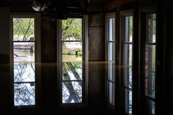 The flooded first floor of Wes Anderson's home is seen as the rising Kentucky River flows outside on Saturday, April 5, 2025, in Frankfort, Ky. (AP Photo/Jon Cherry)