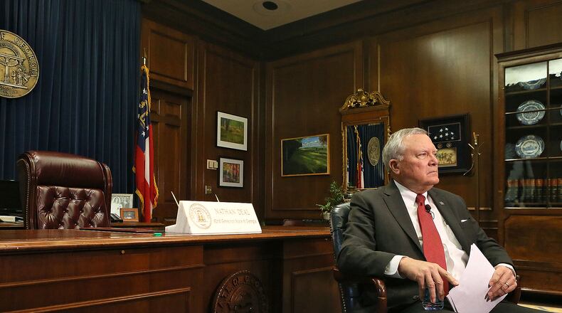 Governor Nathan Deal, shown during a January interview at the State Capitol, has been considering major changes to Georgia's Division of Family and Children Services after two metro Atlanta children and reports in the AJC that mistakes by DFCS workers contributed to at least 25 deaths in 2012. The governor now plans to restructure the agency, sources tell the AJC.
