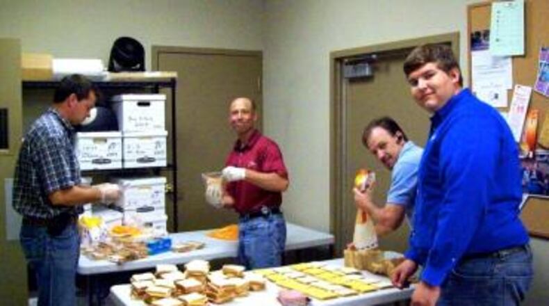 Volunteers from Horizon Construction Co. help serve dinner at the Central Night Shelter in downtown Atlanta. Meals are prepared by our team at the shelter’s kitchen for up to 70 men including a sack lunch for the following day. The shelter provides a number of other services to these men that are seeking warmth and safety during the cold winter months. CONTRIBUTED