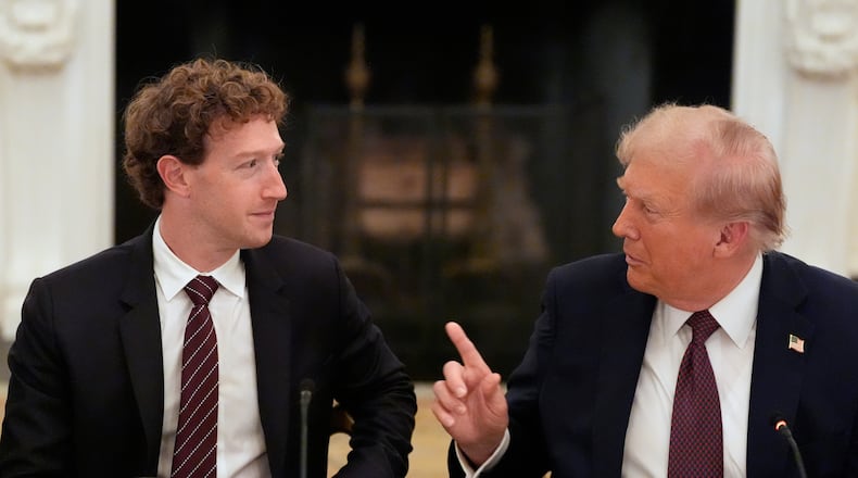 FILE - President Donald Trump speaks to Facebook CEO Mark Zuckerberg during a dinner in the State Dining Room of the White House, Sept. 4, 2025, in Washington. (AP Photo/Alex Brandon, File)