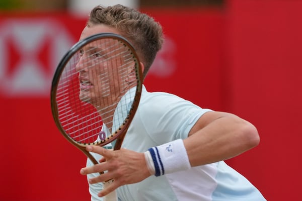 Jiri Lehecka of the Czech Republic reacts after playing a return to Carlos Alcaraz of Spain, during the men's singles final of the Queens Club tennis championships in London, Sunday, June 22, 2025. (AP Photo/Joanna Chan)