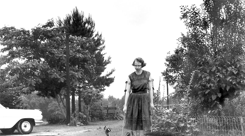 Flannery O’Connor in the driveway at Andalusia, 1962. AJC FILE