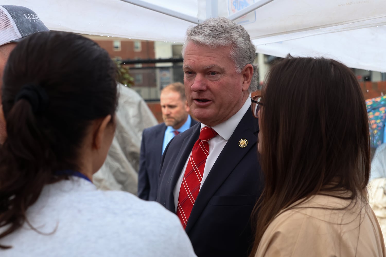 U.S. Rep. Mike Collins, R-Jackson (center), speaks with Laken Riley’s family at UGA’s Tate Plaza on Saturday, Feb. 21, 2026, after a memorial service for Riley. Riley was attacked on Feb. 22, 2024 while running in Oconee Forest Park on the UGA campus and killed. Collins sponsored the Laken Riley Act, which requires detention without bond of people without citizenship who are charged with minor theft or shoplifting or for crimes resulting in death or serious bodily injury, including driving under the influence. José Ibarra, who was convicted of killing Laken Riley, had previously been charged with shoplifting in New York. (C.J. Bartunek for the AJC)
