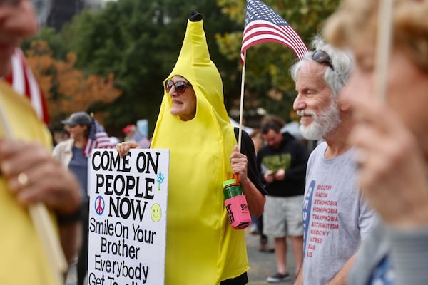 Miriam McCann dressed up as a banana to show that demonstrators intend on remaining peaceful. (Abbey Cutrer/AJC)