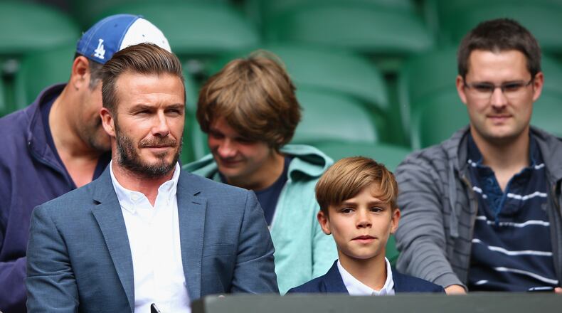 LONDON, ENGLAND - JULY 08: David Beckham and son Romeo Beckham attend day nine of the Wimbledon Lawn Tennis Championships at the All England Lawn Tennis and Croquet Club on July 8, 2015 in London, England. (Photo by Ian Walton/Getty Images)