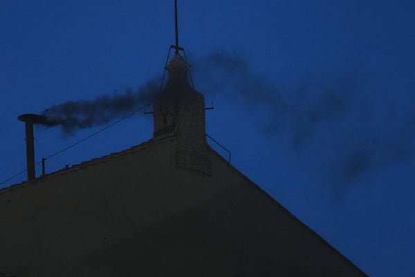 Black smoke billows from the chimney of the Sistine Chapel during the cardinals' conclave to elect a new pope, at the Vatican, Wednesday, May 7, 2025. (AP Photo/Alessandra Tarantino)