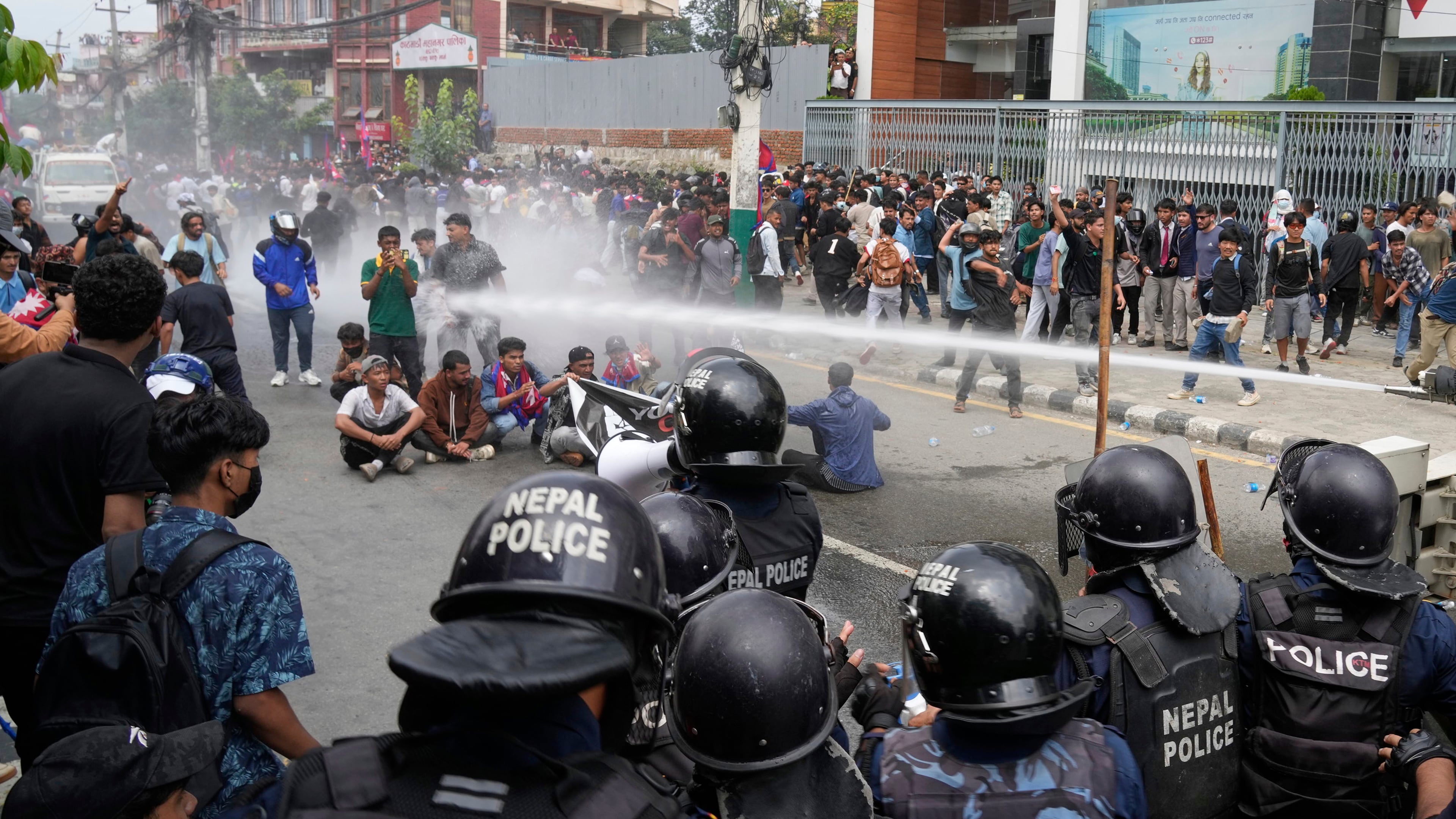 Riot police use water cannon on protesters during clashes outside parliament building in Kathmandu, Nepal, Monday, Sept. 8, 2025. (AP Photo/Niranjan Shrestha)