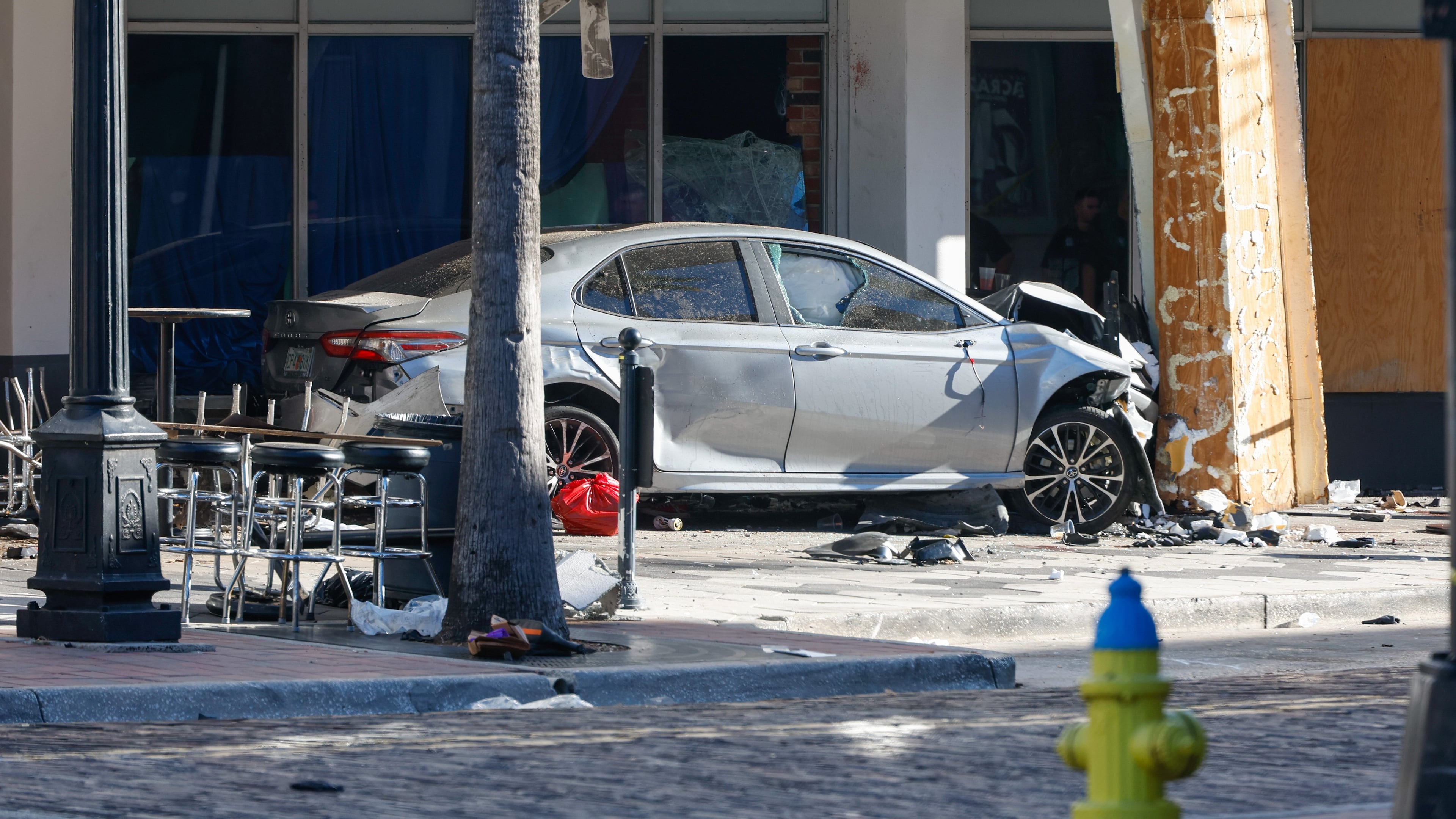 A car that crashed into a local business is shown on Saturday, Nov. 8, 2025, in Tampa, Fla. (Jefferee Woo/Tampa Bay Times via AP)