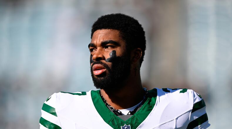 FILE - New York Jets cornerback Qwan'Tez Stiggers warms up before an NFL football game against the Jacksonville Jaguars in Jacksonville, Fla., Dec. 14, 2025. (AP Photo/Phelan M. Ebenhack, File)