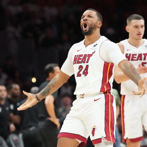 Miami Heat guard Norman Powell (24) reacts after scoring during the second half of an NBA basketball game against the Cleveland Cavaliers Monday, Nov. 10, 2025, in Miami. (AP Photo/Marta Lavandier)