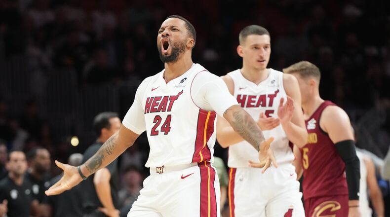 Miami Heat guard Norman Powell (24) reacts after scoring during the second half of an NBA basketball game against the Cleveland Cavaliers Monday, Nov. 10, 2025, in Miami. (AP Photo/Marta Lavandier)