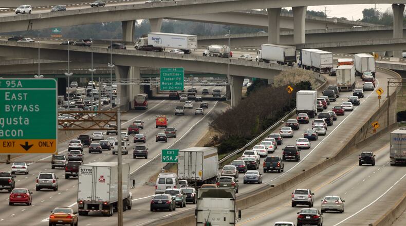 Automobiles travel through Spaghetti Junction, with some stacking up on the I-285 East ramp on a typical day. DeKalb County and metro Atlanta as a whole are projected to continue growing over the next 25 years. JASON GETZ / JGETZ@AJC.COM