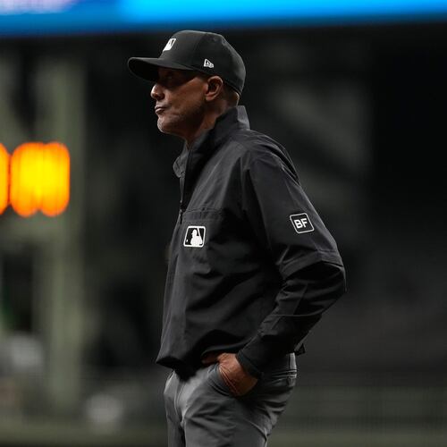 Umpire CB Bucknor looks on during the eighth inning of a baseball game between the Milwaukee Brewers and the Tampa Bay Rays, Tuesday, March 31, 2026, in Milwaukee. (AP Photo/Aaron Gash)