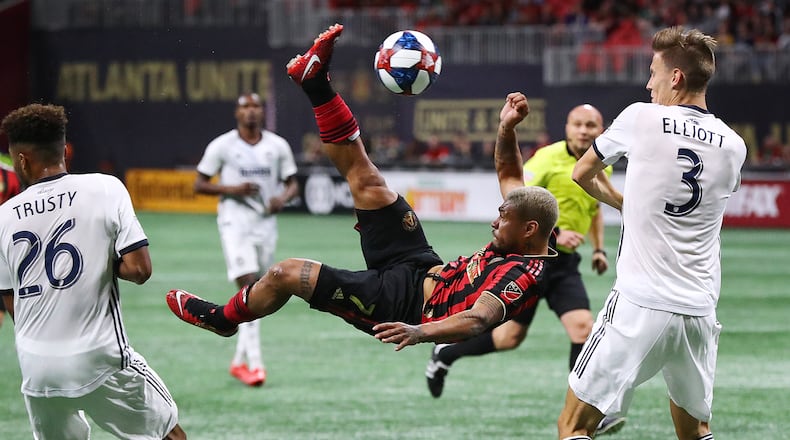 **** VISUAL LEDE **** March 17, 2019 Atlanta: Atlanta United forward Josef Martinez makes a bicycle kick between Philadelphia Union defenders Auston Trusty and Jack Elliott that was blocked by goalkeeper Andre Blake during the second half in a MLS soccer match that ended in a 1-1 draw on Sunday, March 17, 2019, in Atlanta.   Curtis Compton/ccompton@ajc.com