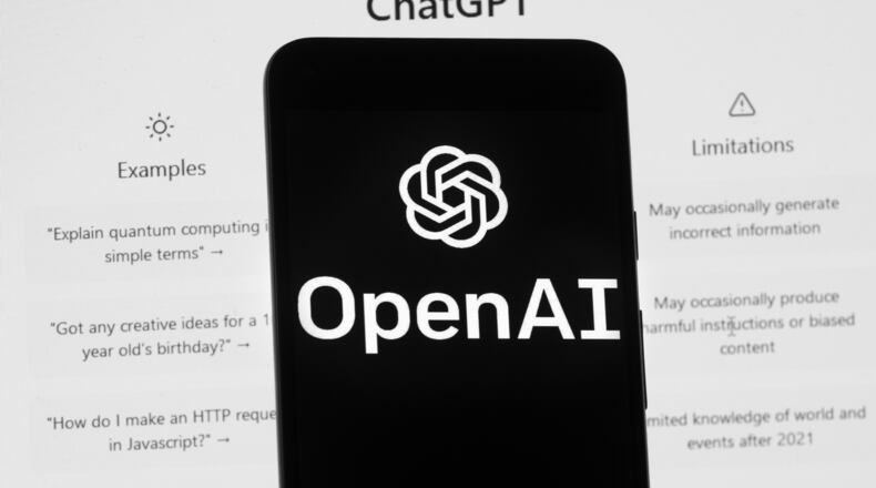 FILE - The OpenAI logo is seen on a mobile phone in front of a computer screen which displays the ChatGPT home Screen, March 17, 2023, in Boston. (AP Photo/Michael Dwyer, File)