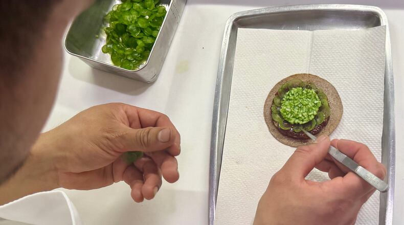 A tostada with bluefin tuna is prepared at Californios in San Francisco on Thursday, July 16, 2026. (AP Photo/Haven Daley)