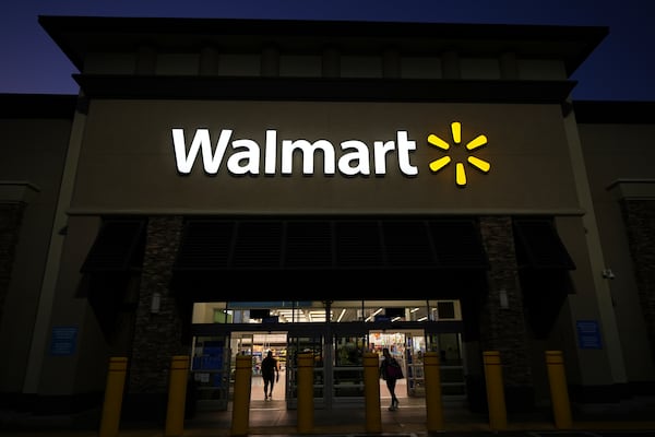 Shoppers enter a Walmart store in La Habra, Calif., Wednesday, April 9, 2025. (AP Photo/Jae C. Hong)