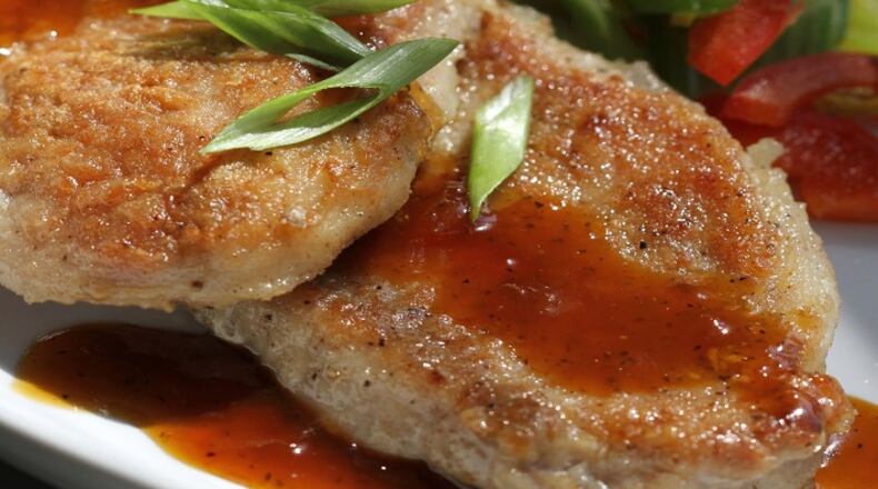 Skillet Pork Chops, with sauteed celery and apricot glaze, in a 2012 file image. (Jessica J. Trevino/Detroit Free Press/TNS)