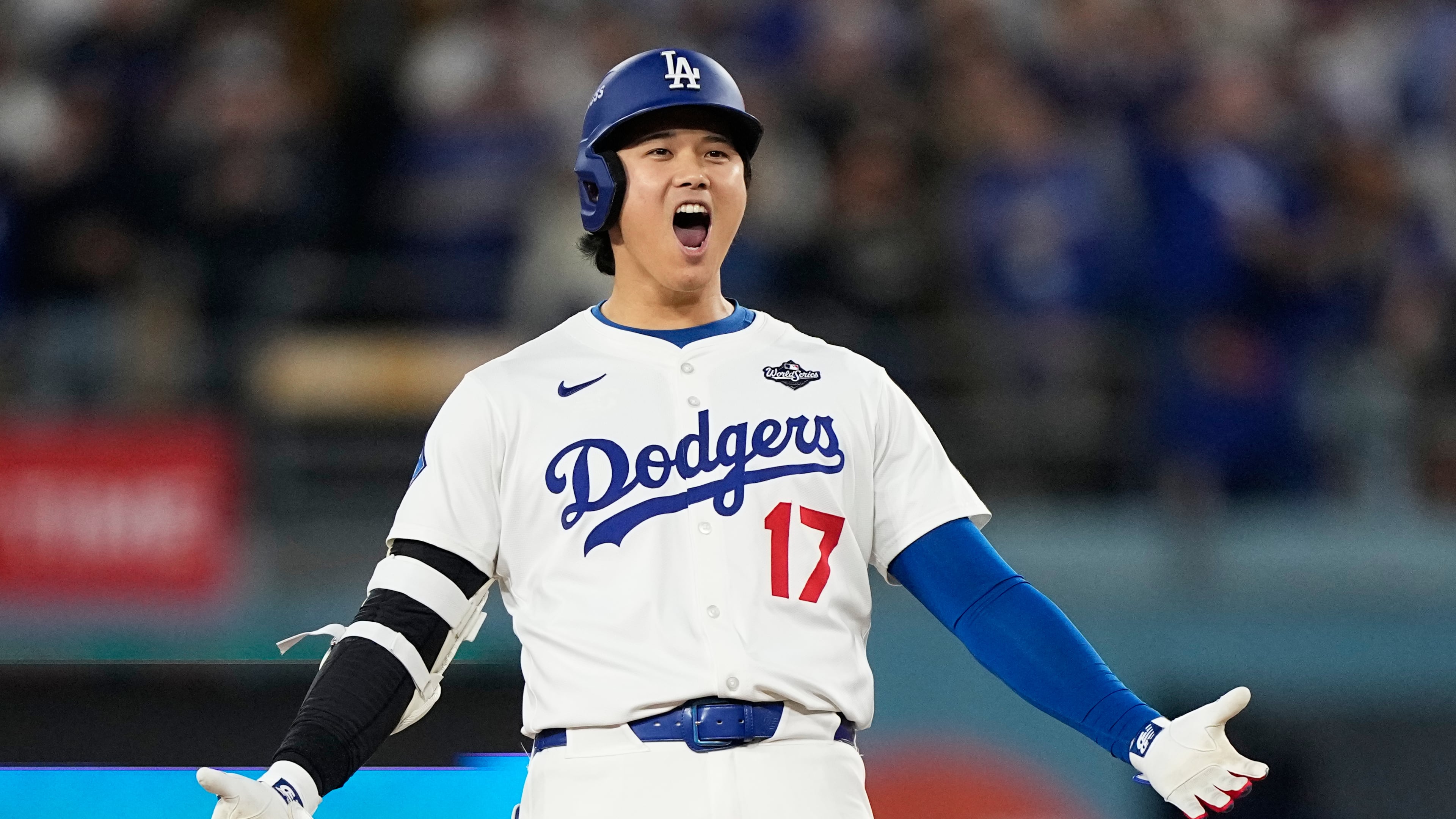 Los Angeles Dodgers' Shohei Ohtani celebrates hit RBI-Double against the Toronto Blue Jays during the fifth inning in Game 3 of baseball's World Series, Monday, Oct. 27, 2025, in Los Angeles. (AP Photo/Brynn Anderson)