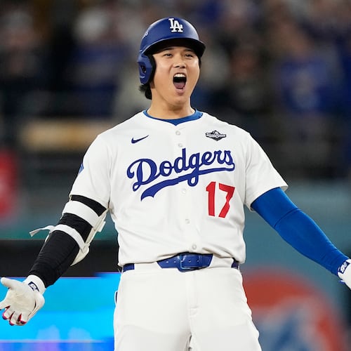 Los Angeles Dodgers' Shohei Ohtani celebrates hit RBI-Double against the Toronto Blue Jays during the fifth inning in Game 3 of baseball's World Series, Monday, Oct. 27, 2025, in Los Angeles. (AP Photo/Brynn Anderson)