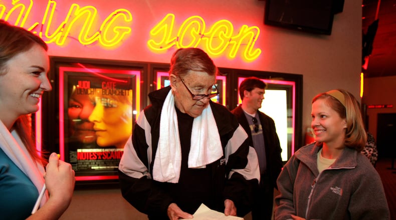 Larry Munson and his film club prepare to catch a showing of "Casino Royale" in 2006 in Athens. Munson, the legendary voice of the Georgia Bulldogs who died Sunday at the age of 89, hosted a movie club that met every Saturday and always for the first show.