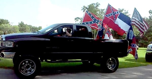 One of the pickups in a Confederate-flag-waving caravan, whose drivers and passengers wreaked havoc across two counties west of Atlanta in July 2015. (photo credit: Southern Poverty Law Center and Facebook)